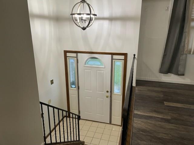 113 Louis Drive McKees Rocks, PA 15136 - Photo 3 of 25 a view of a hallway with wooden floor and staircase