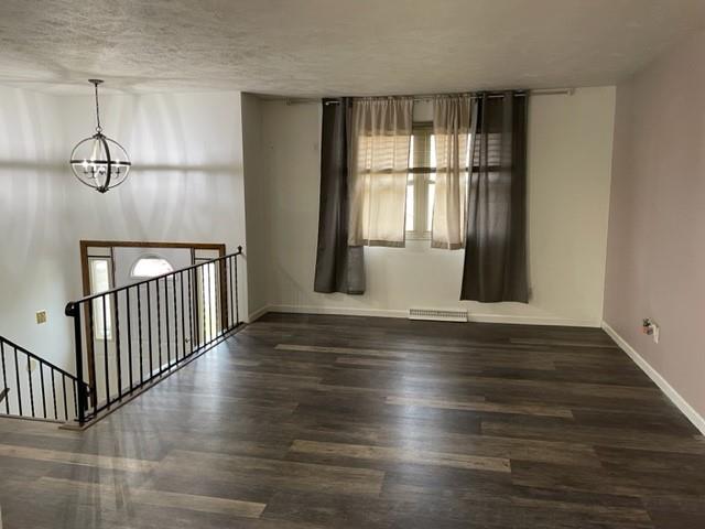 113 Louis Drive McKees Rocks, PA 15136 - Photo 4 of 25 a view of an empty room with wooden floor and a window