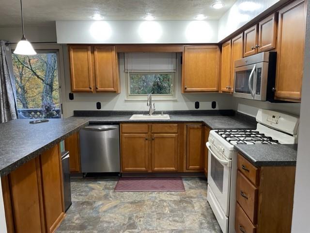 113 Louis Drive McKees Rocks, PA 15136 - Photo 9 of 25 a kitchen with stainless steel appliances granite countertop a sink stove and cabinets