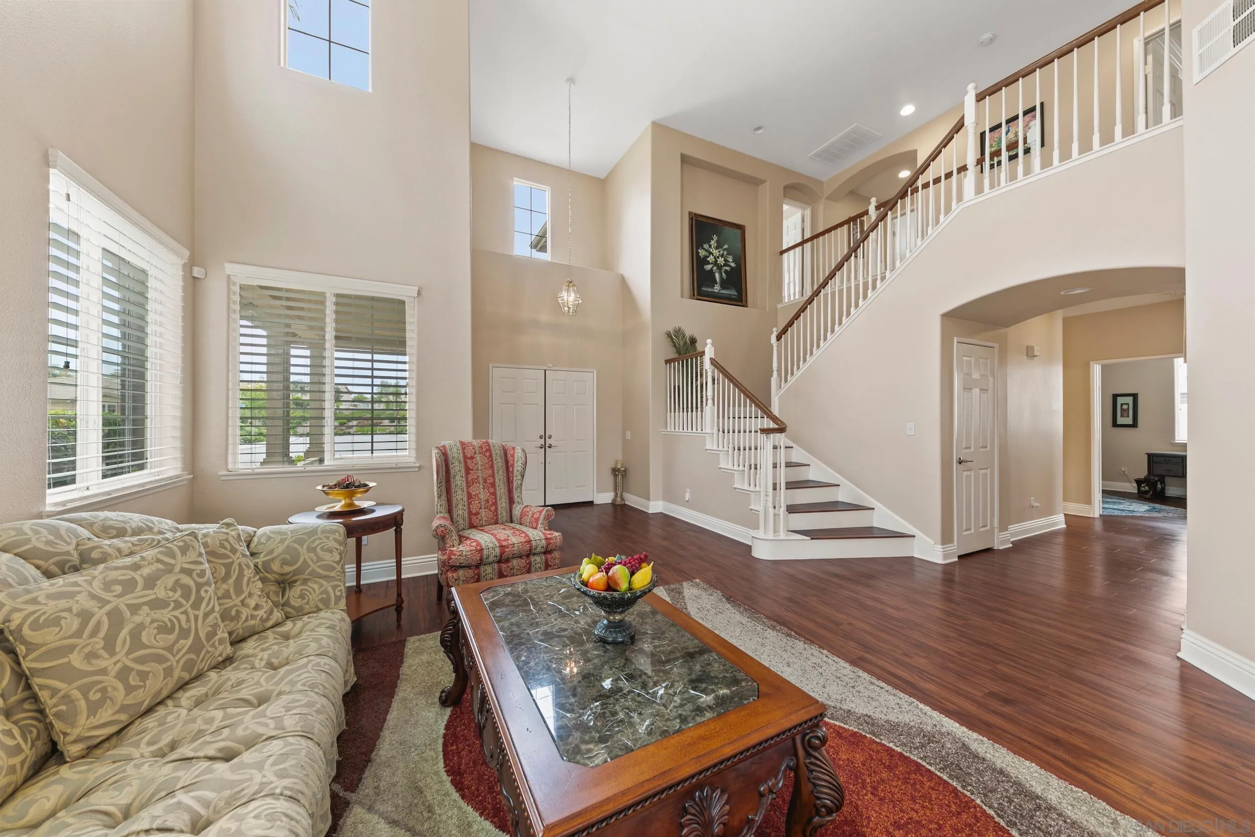 35920 Devonshire Lane Wildomar, CA 92595 - Photo 11 of 50 a living room with furniture and a dining table with wooden floor