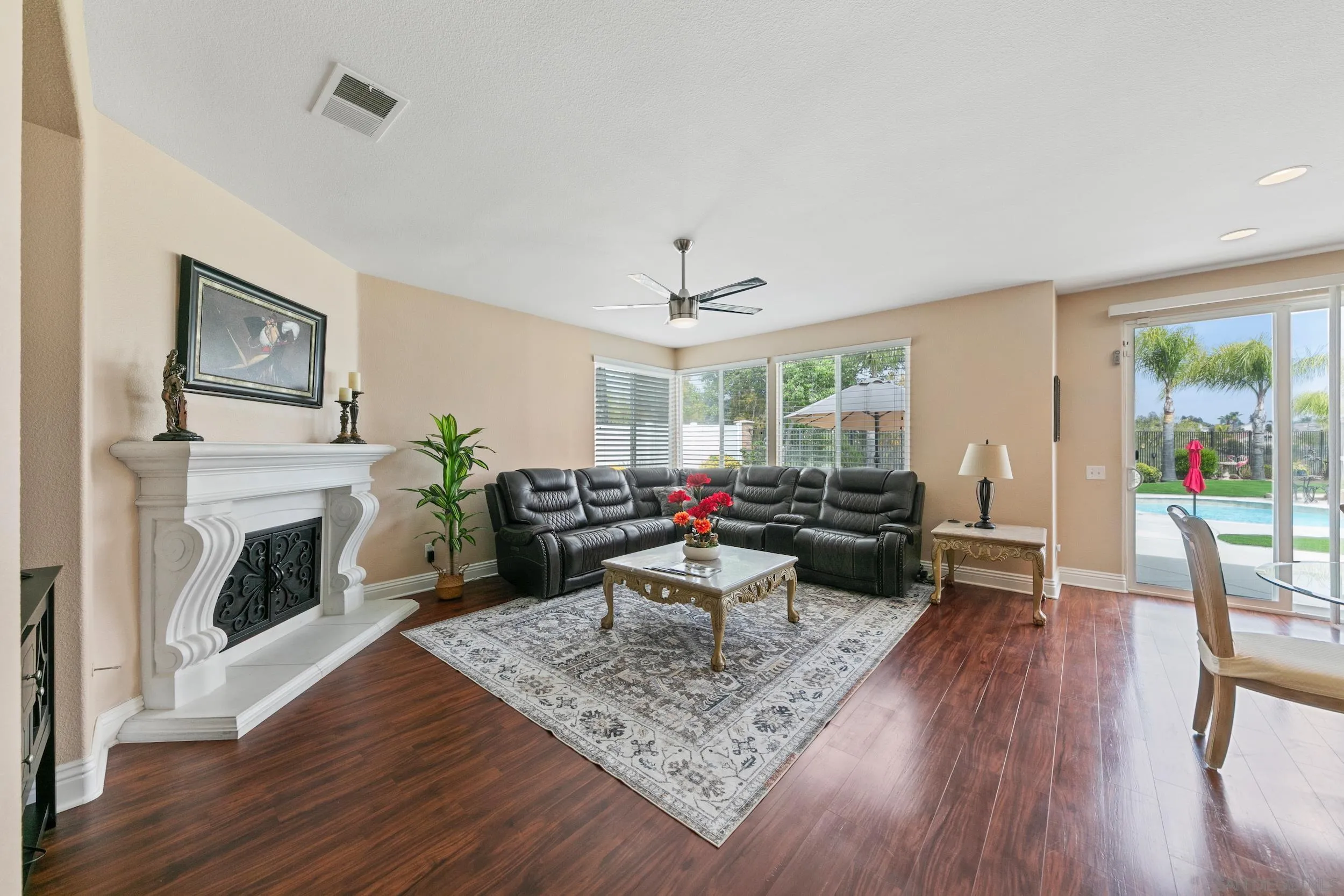 35920 Devonshire Lane Wildomar, CA 92595 - Photo 19 of 50 a living room with furniture a fireplace and a table
