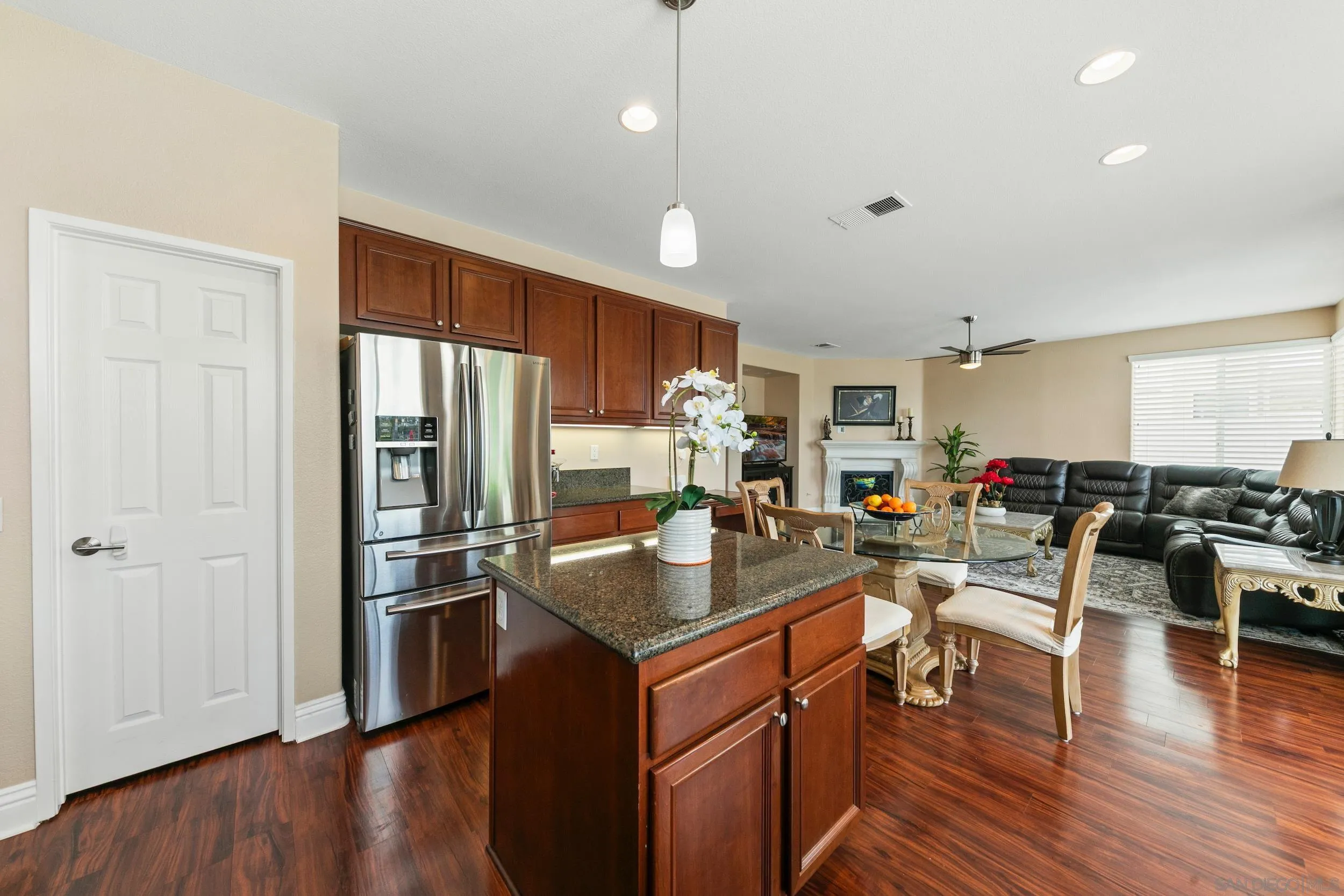 35920 Devonshire Lane Wildomar, CA 92595 - Photo 23 of 50 a kitchen with counter top space a sink appliances and cabinets