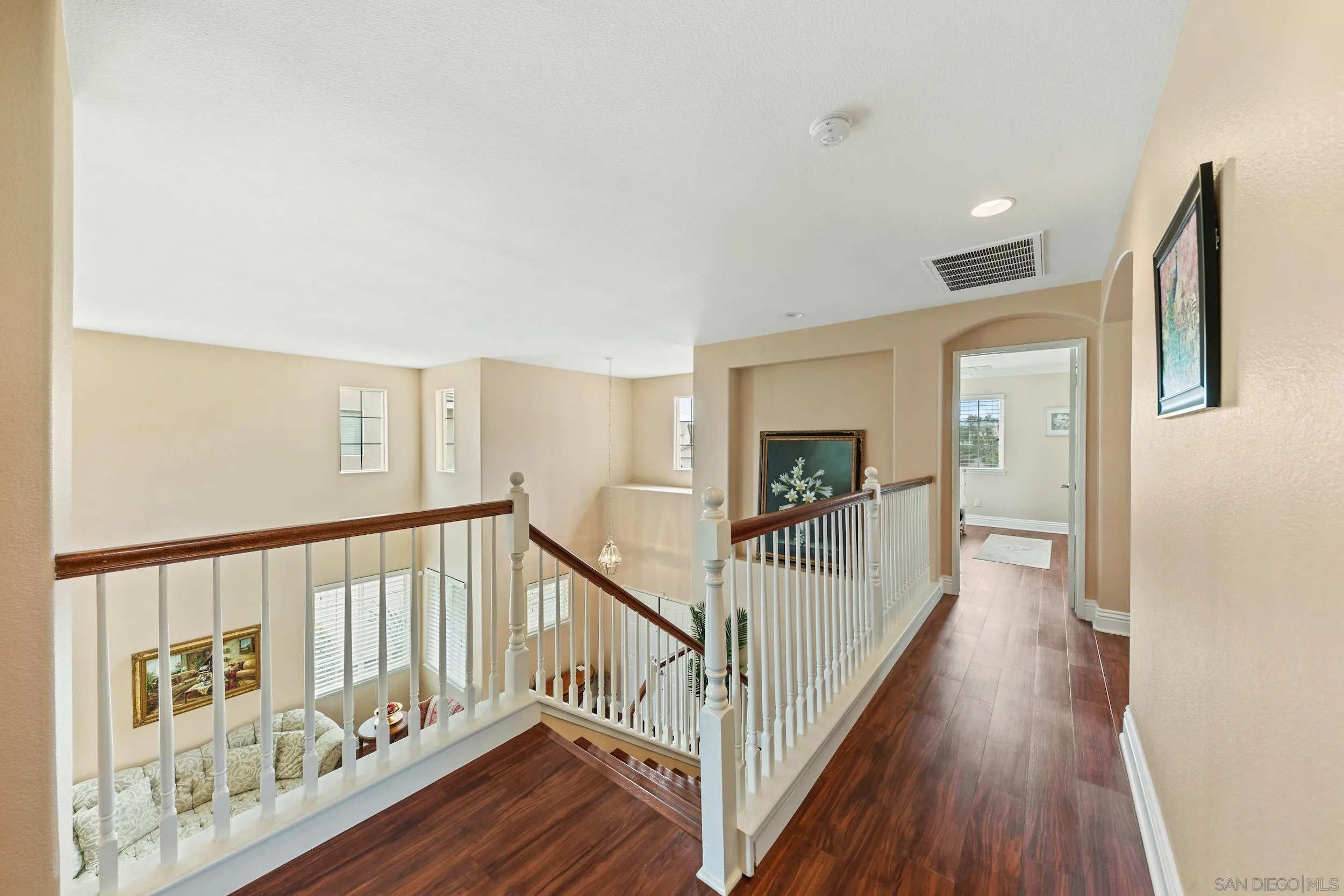 35920 Devonshire Lane Wildomar, CA 92595 - Photo 24 of 50 a view of a hallway with wooden floor and windows