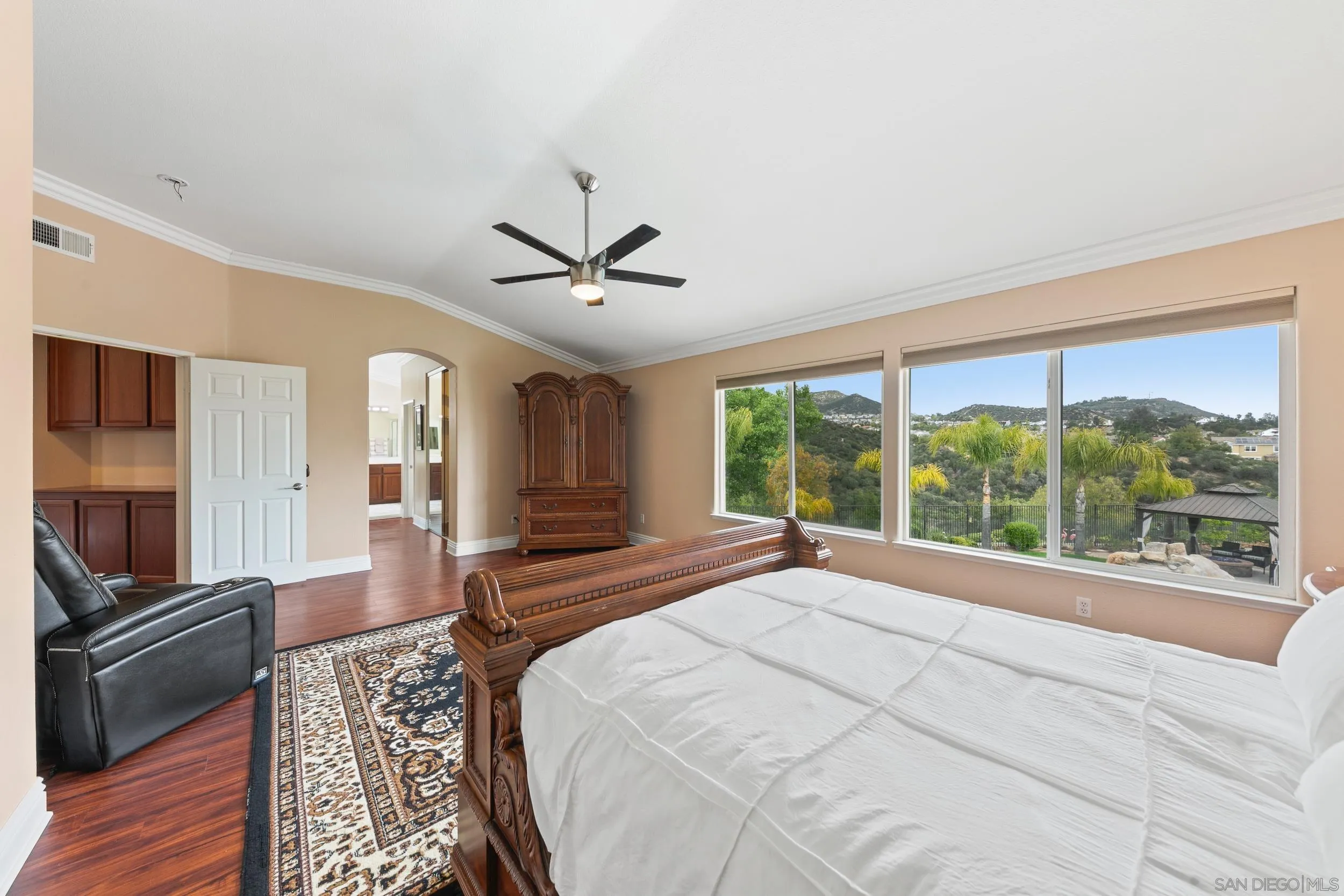 35920 Devonshire Lane Wildomar, CA 92595 - Photo 27 of 50 a spacious bedroom with a large bed and a large window