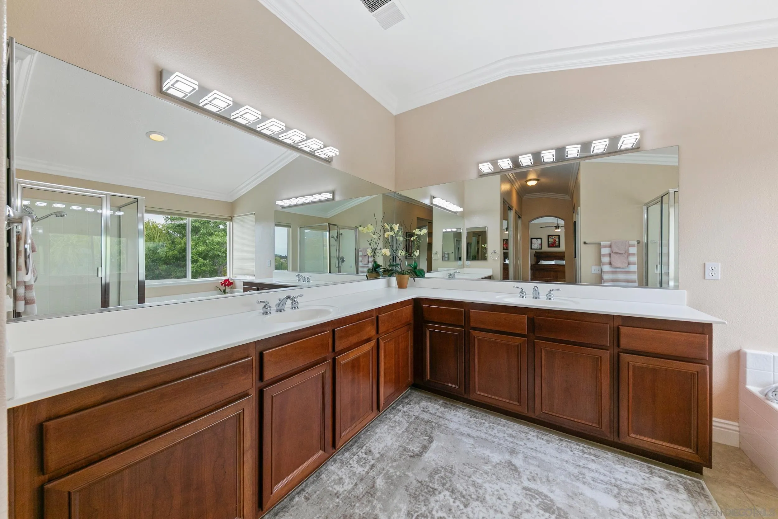 35920 Devonshire Lane Wildomar, CA 92595 - Photo 30 of 50 a spacious bathroom with a granite countertop sink mirror and a