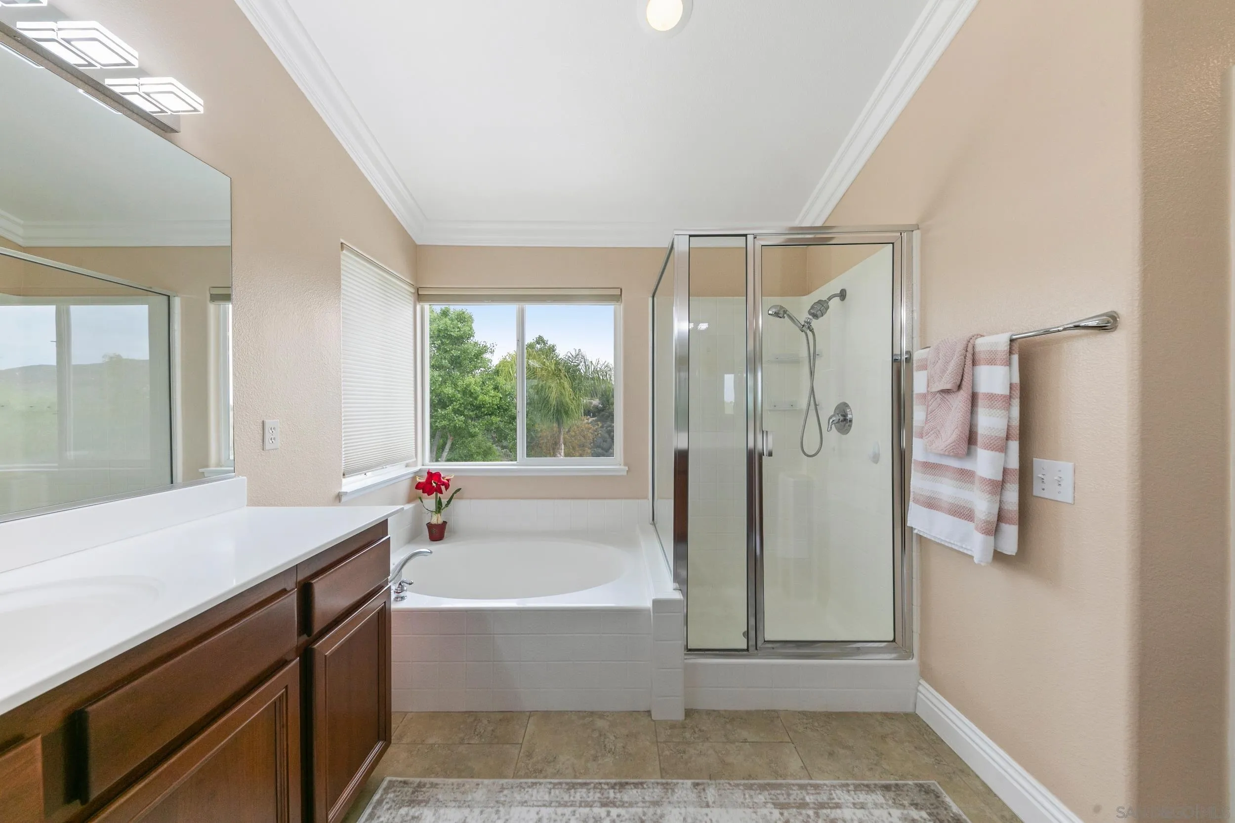 35920 Devonshire Lane Wildomar, CA 92595 - Photo 32 of 50 a bathroom with a tub shower and sink
