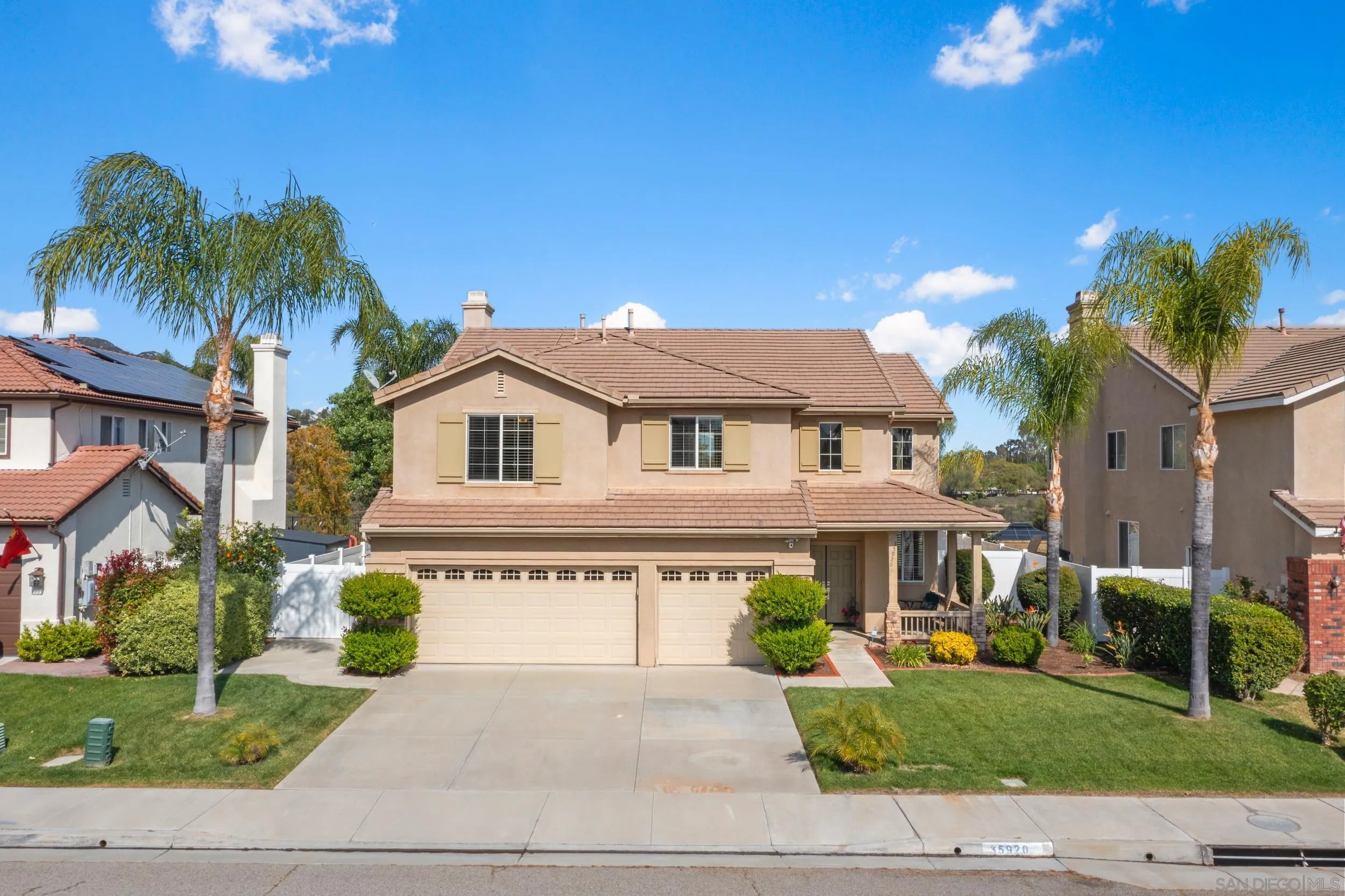 35920 Devonshire Lane Wildomar, CA 92595 - Photo 4 of 50 a front view of a house with a garden and a yard