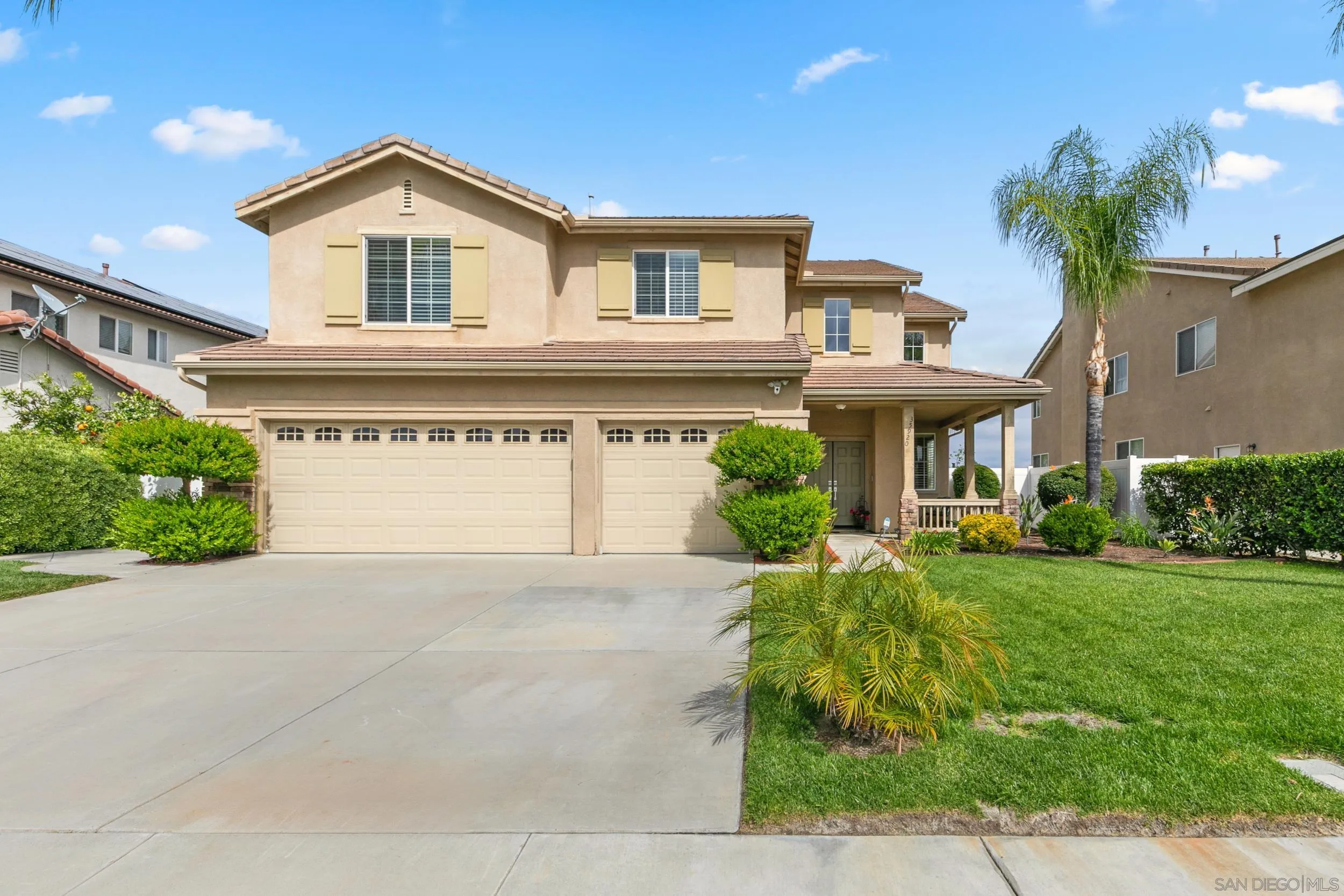 35920 Devonshire Lane Wildomar, CA 92595 - Photo 42 of 50 a front view of a house with a yard and garage