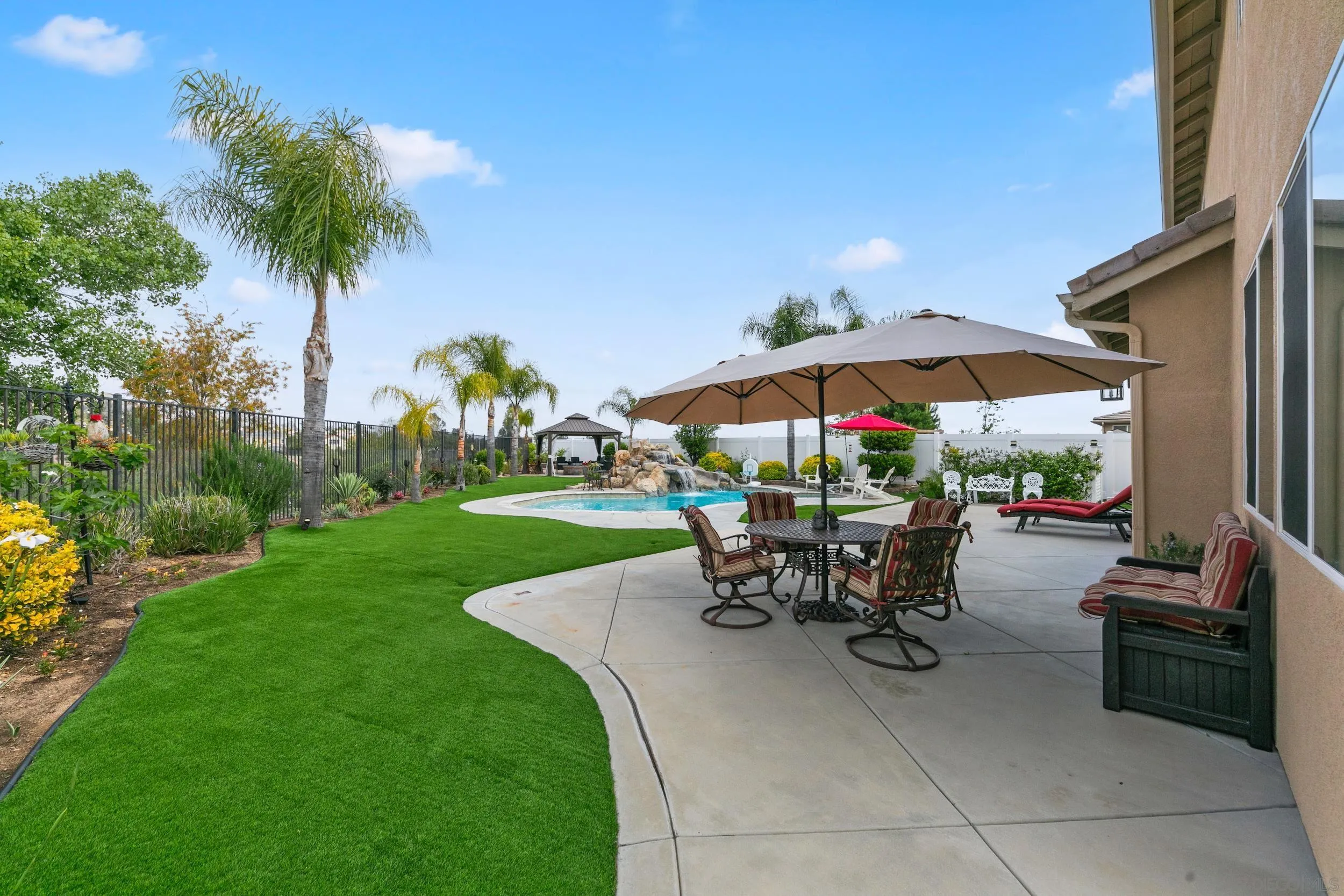 35920 Devonshire Lane Wildomar, CA 92595 - Photo 44 of 50 a view of a backyard with sitting area and furniture
