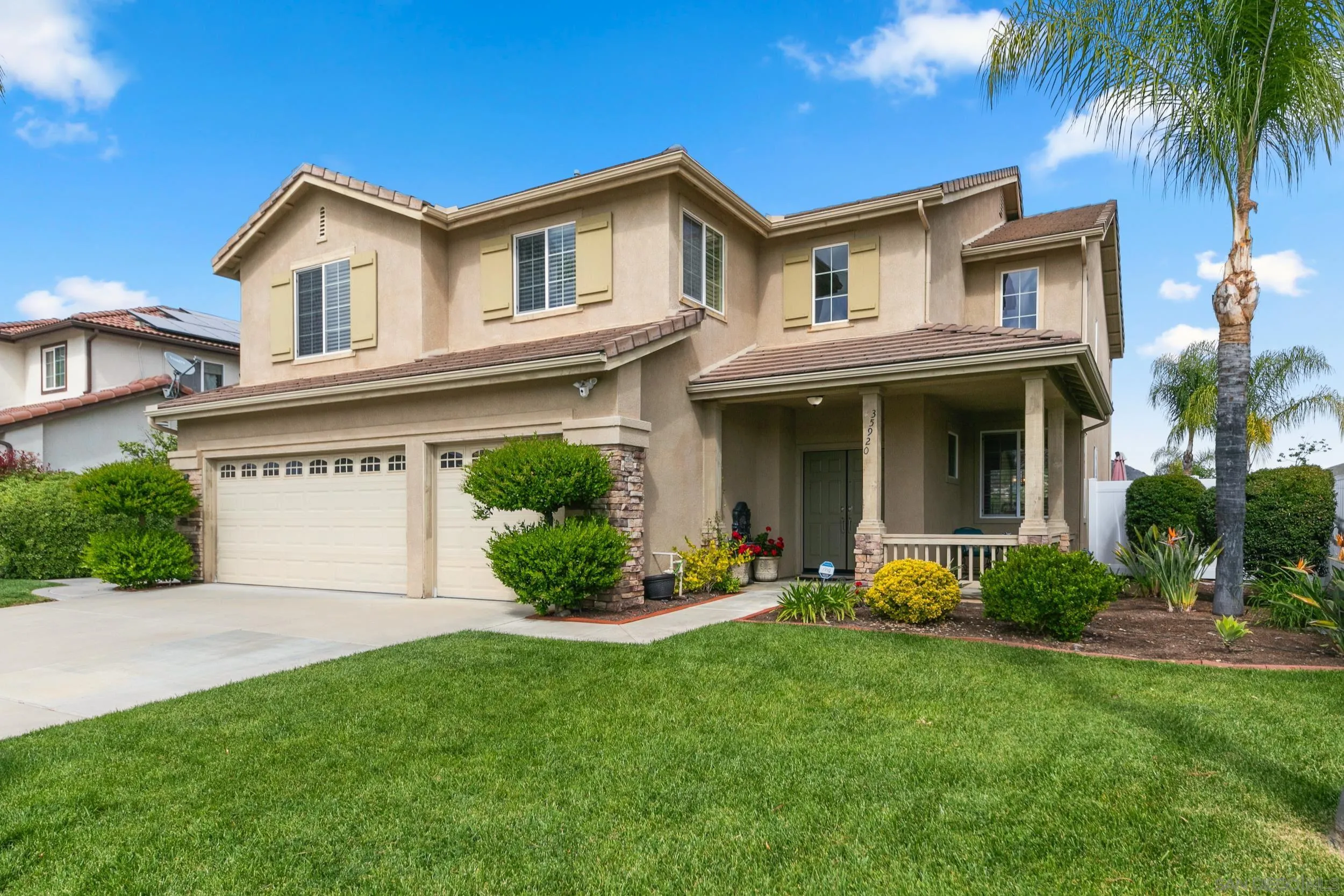 35920 Devonshire Lane Wildomar, CA 92595 - Photo 6 of 50 a front view of a house with a garden and plants