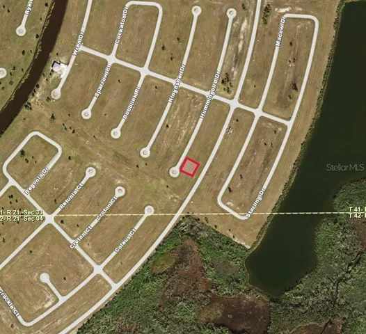 an aerial view of a house with a street