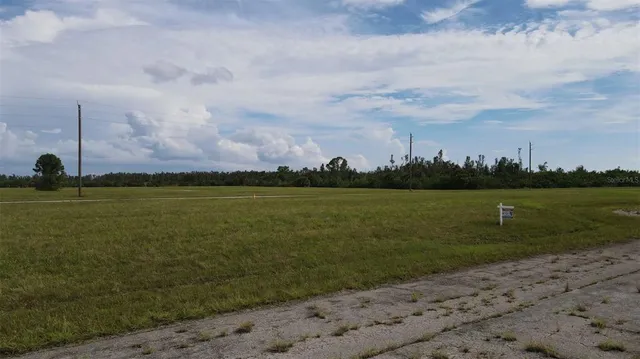 a view of a lake with a big yard