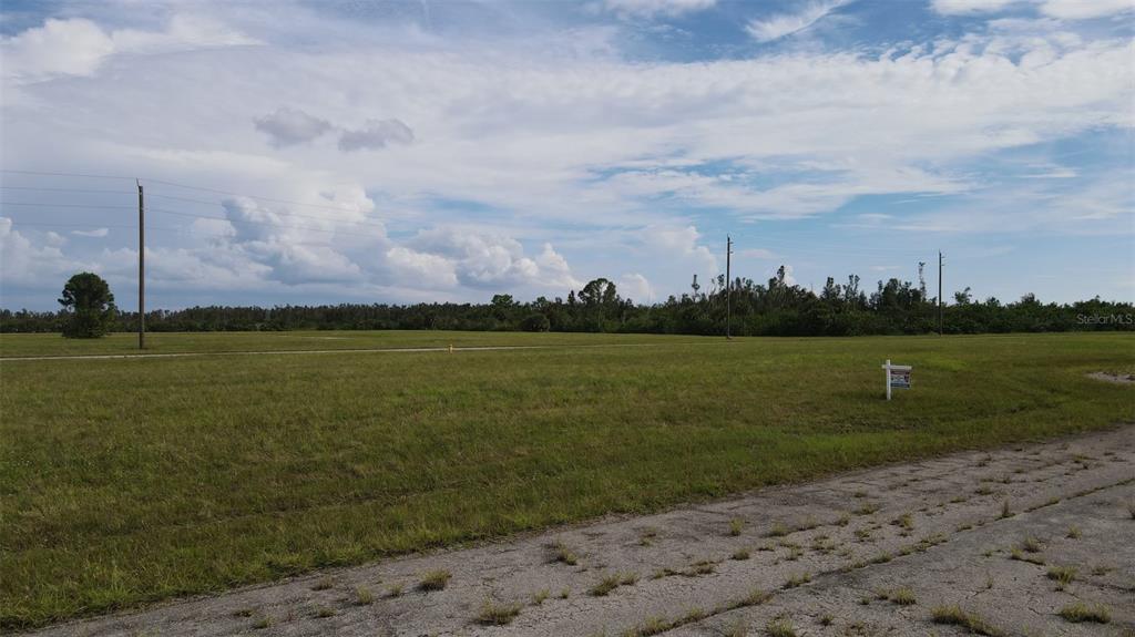 6 Hummingbird Drive Placida, FL 33946 - Photo 7 of 14 a view of a lake with a big yard