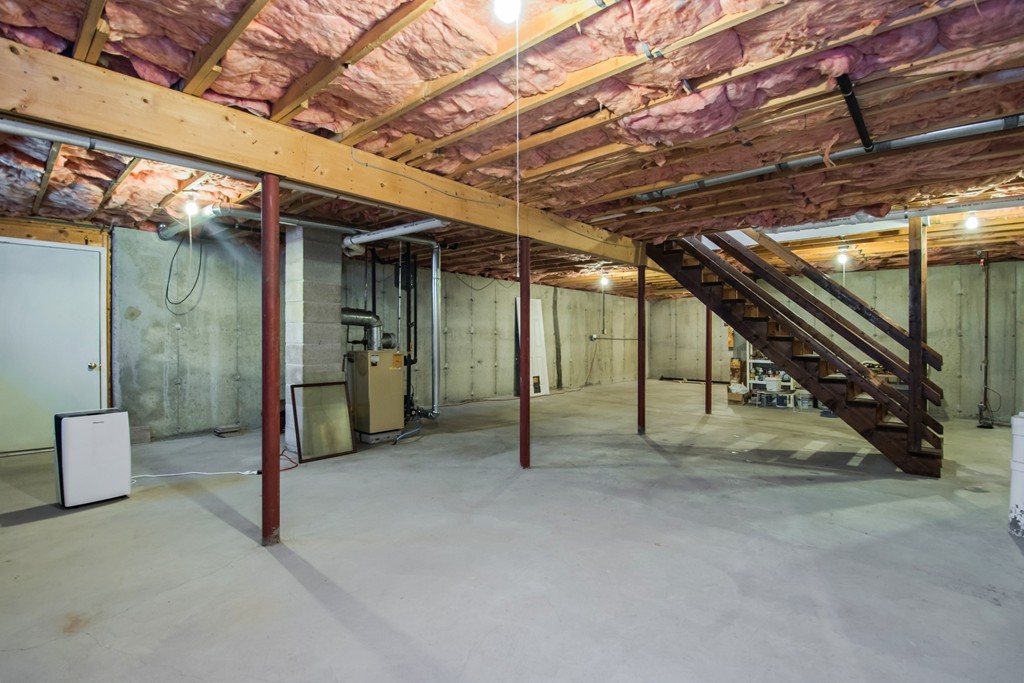 6 Chandler Way, Unit 6 Northborough, MA 01532 - Photo 27 of 37 a view of an empty room with wooden walls