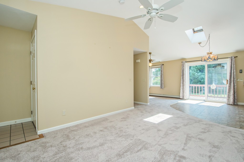 6 Chandler Way, Unit 6 Northborough, MA 01532 - Photo 8 of 37 an empty room with windows and entrance