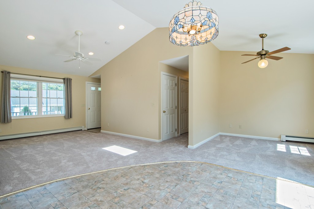 6 Chandler Way, Unit 6 Northborough, MA 01532 - Photo 10 of 37 wooden floor in an empty room with a window