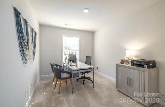 a workspace with furniture and window