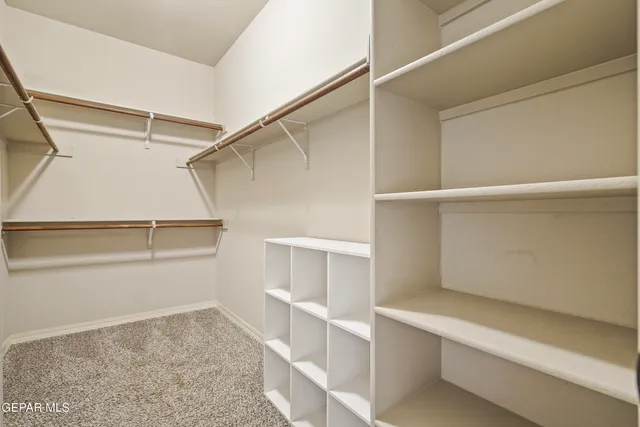 a view of an empty walk in closet