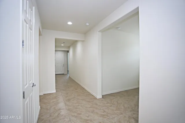 a view of an empty room and a window