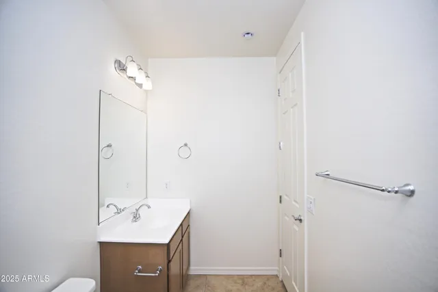 a kitchen with stainless steel appliances a refrigerator sink and microwave