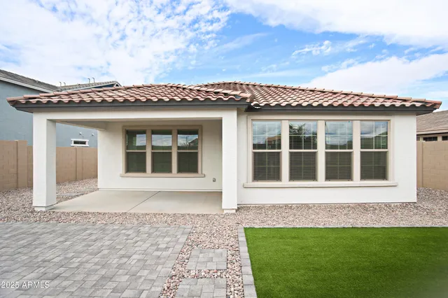 a black and white house with a outdoor space
