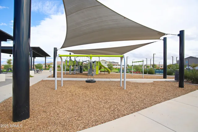 a view of a swimming pool and a yard