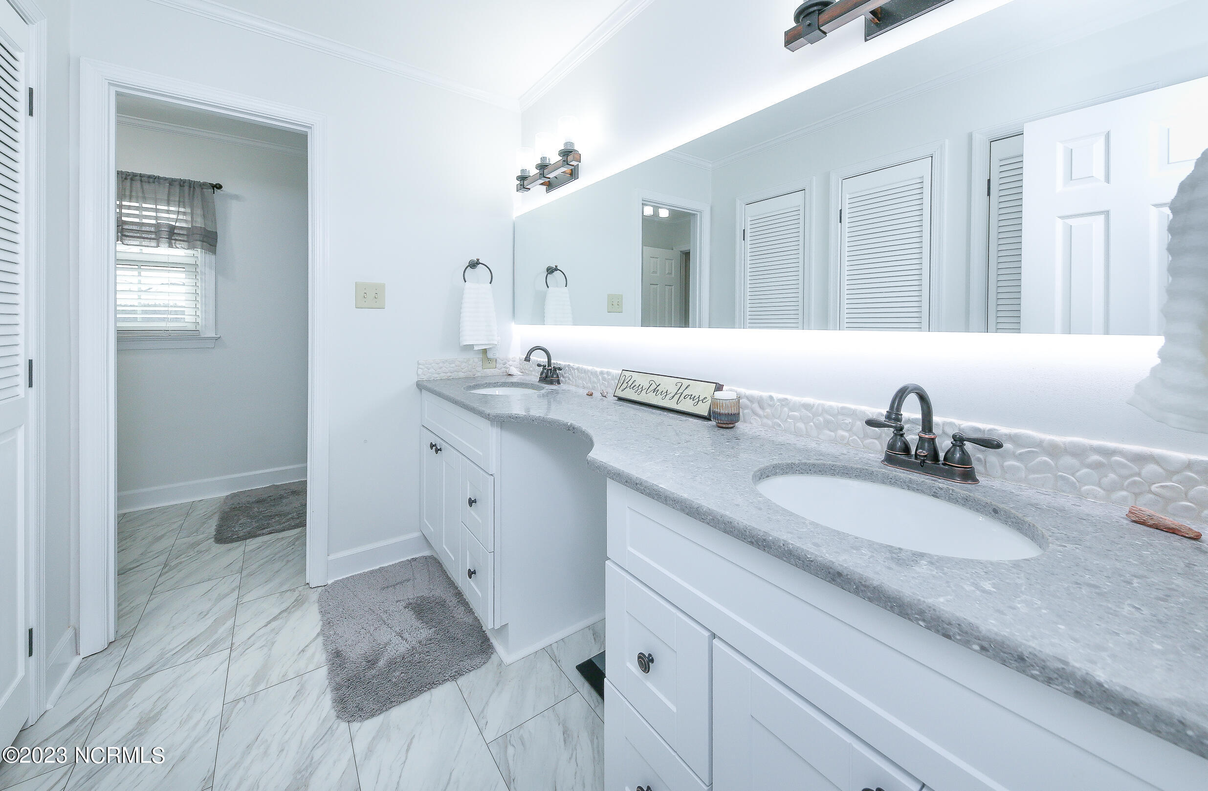 139 Johnny Harrell Road Gates, NC 27937 - Photo 10 of 56 Beautiful master bath with quartz countertop and backlit mirror with vanity cut-out.
