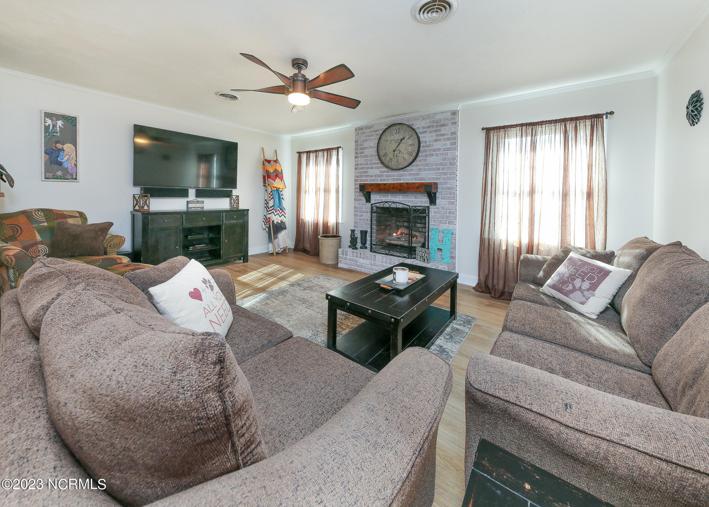 139 Johnny Harrell Road Gates, NC 27937 - Photo 20 of 56 Living area with wonderful and warming gas logs!