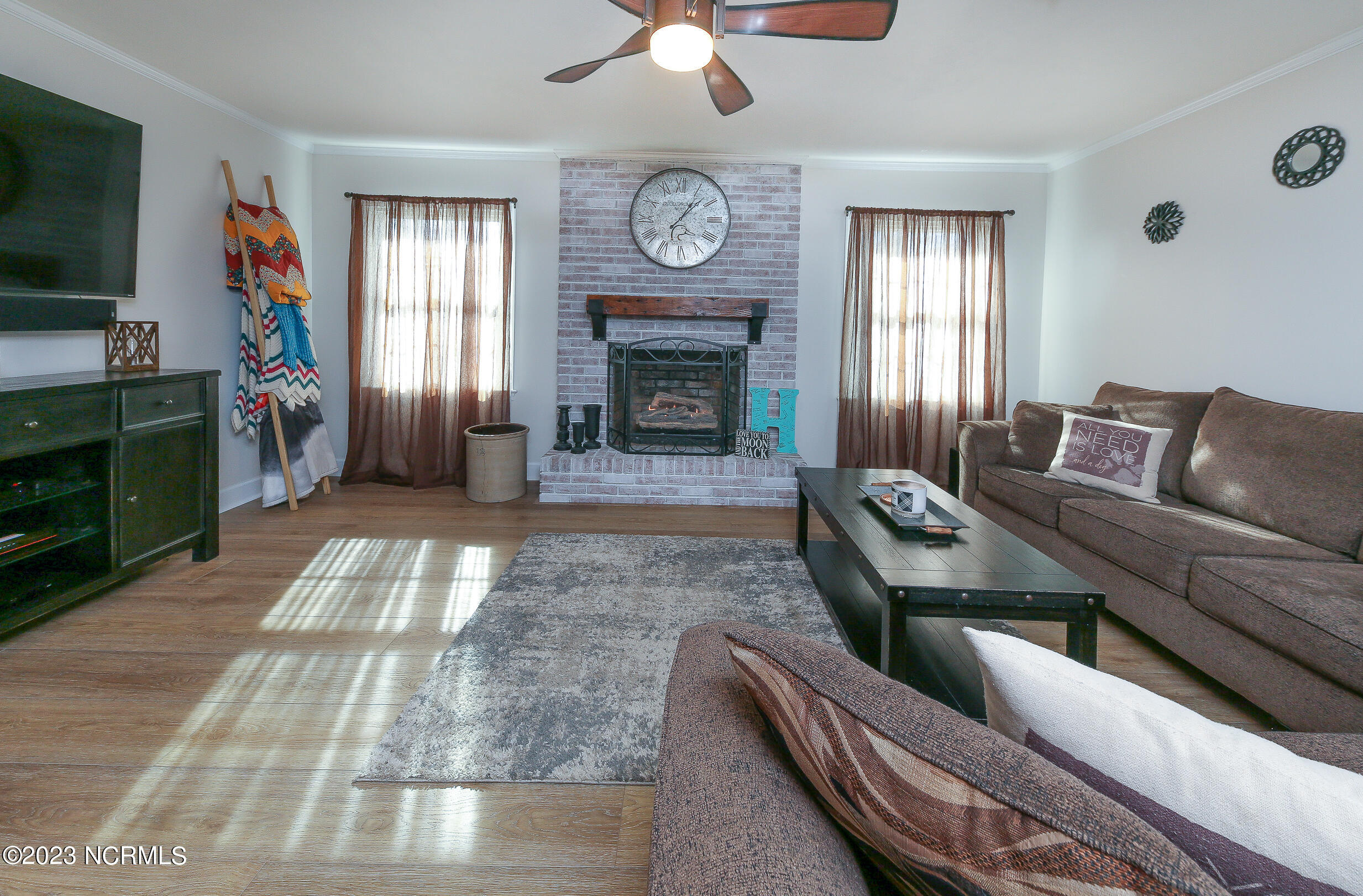 139 Johnny Harrell Road Gates, NC 27937 - Photo 21 of 56 Convenient gas log fireplace can be converted back to wood burning if desired.