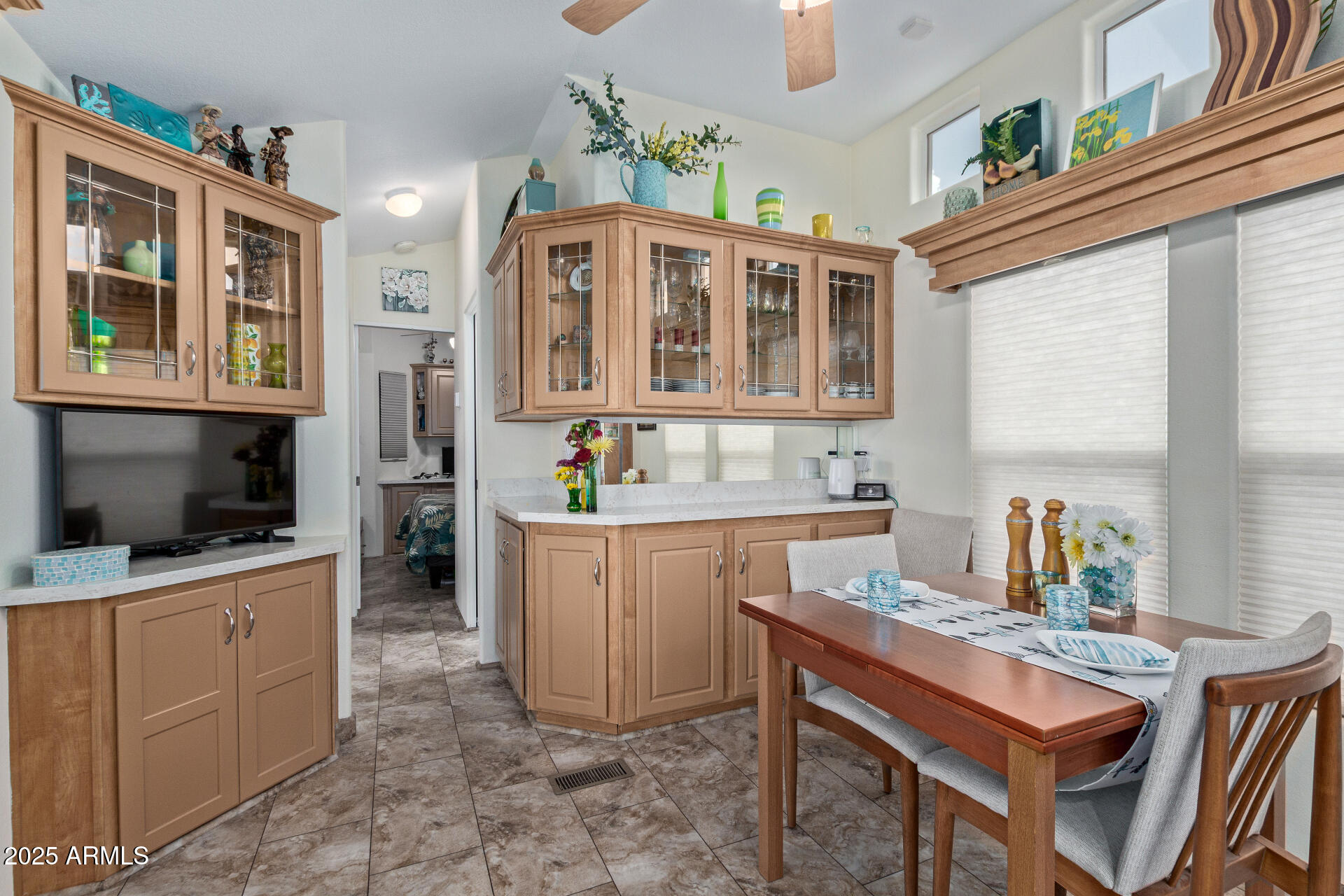 111 South Greenfield Road, Unit 449 Mesa, AZ 85206 - Photo 11 of 34 a kitchen with a stove a sink and a microwave