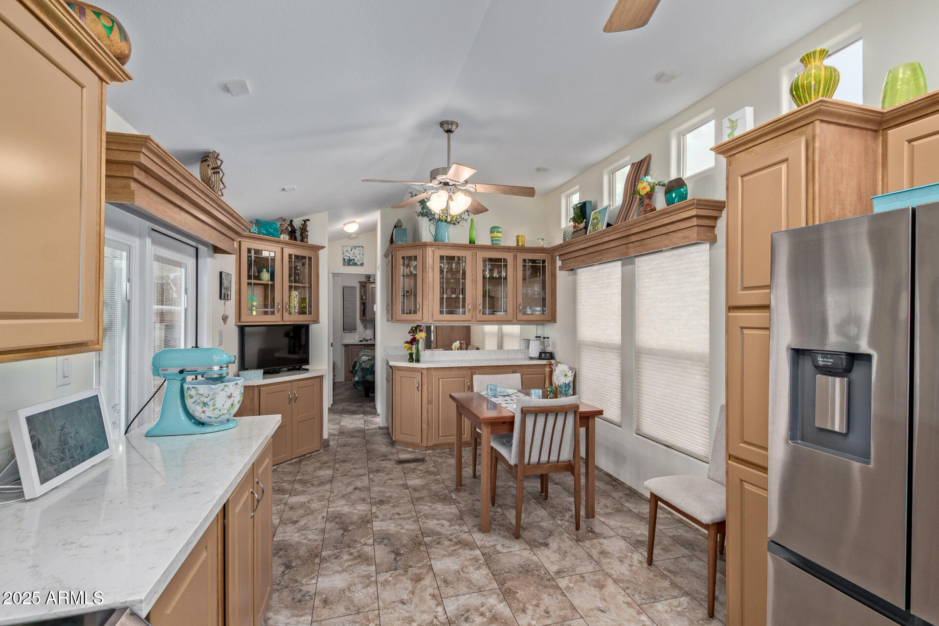 111 South Greenfield Road, Unit 449 Mesa, AZ 85206 - Photo 15 of 34 a kitchen with stainless steel appliances granite countertop a refrigerator and a sink