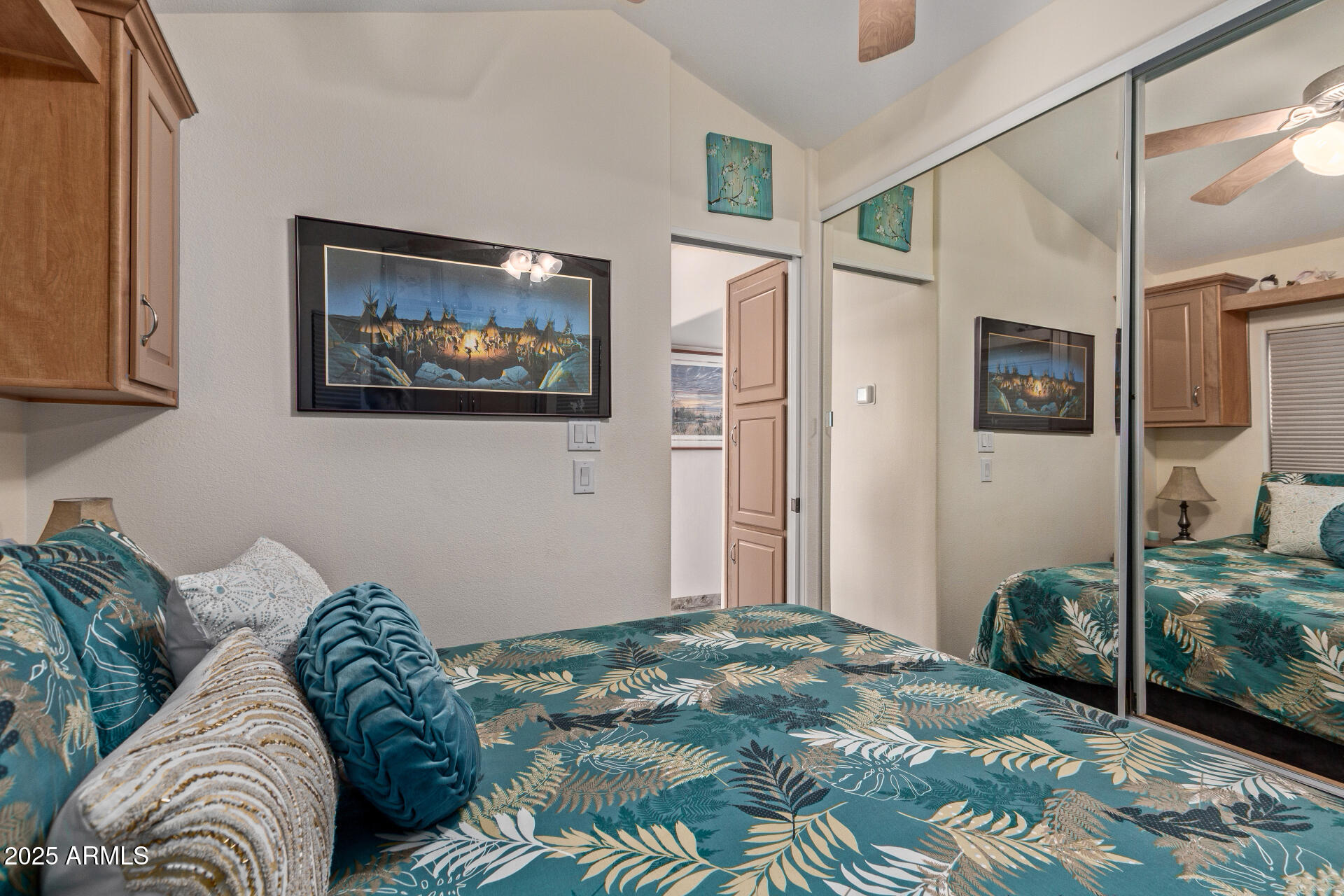 111 South Greenfield Road, Unit 449 Mesa, AZ 85206 - Photo 17 of 34 a bedroom with a bed and a painting on the wall