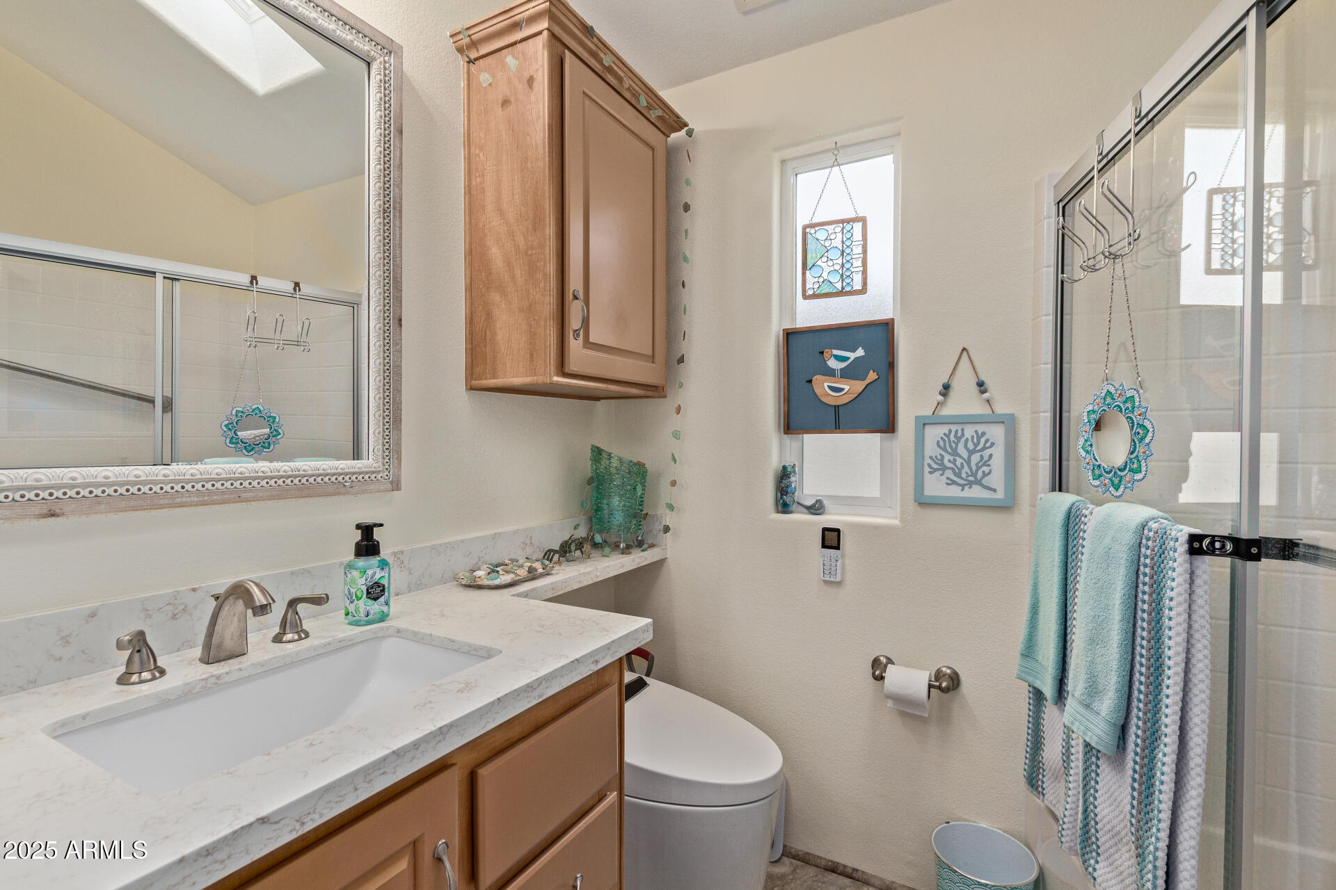 111 South Greenfield Road, Unit 449 Mesa, AZ 85206 - Photo 19 of 34 a bathroom with a granite countertop sink toilet and shower