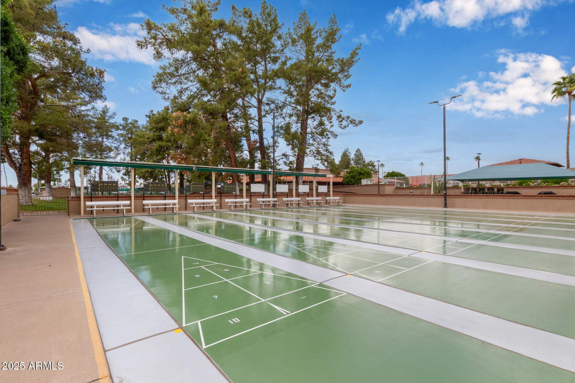 111 South Greenfield Road, Unit 449 Mesa, AZ 85206 - Photo 23 of 34 a view of a swimming pool with a lawn chairs