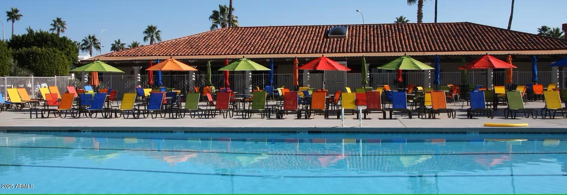 111 South Greenfield Road, Unit 449 Mesa, AZ 85206 - Photo 34 of 34 a view of people sitting outside of a house
