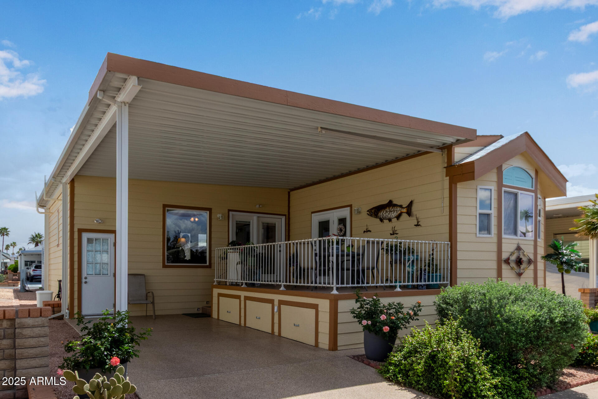 111 South Greenfield Road, Unit 449 Mesa, AZ 85206 - Photo 6 of 34 a view of a house with wooden floor and potted plants
