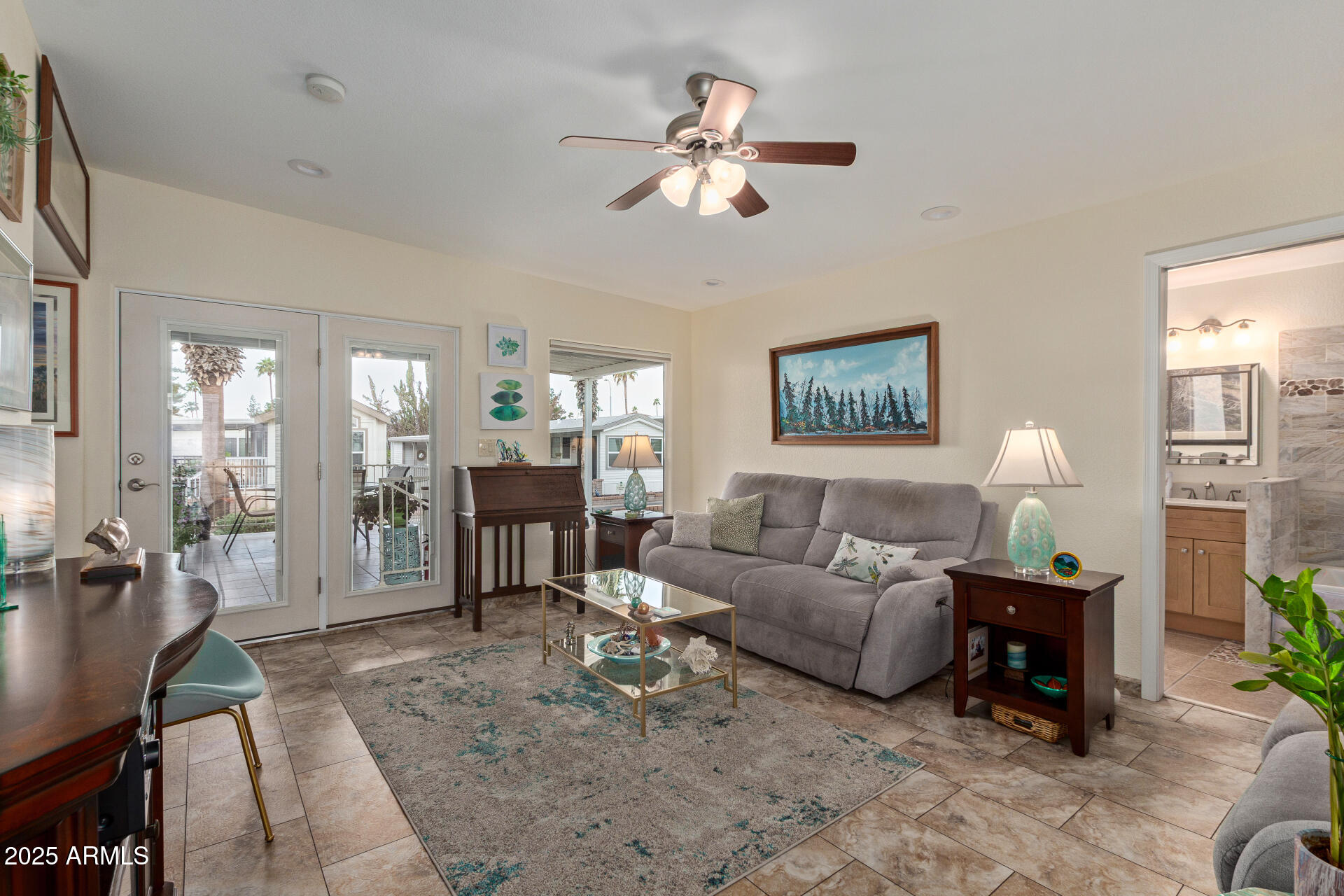 111 South Greenfield Road, Unit 449 Mesa, AZ 85206 - Photo 8 of 34 a living room with furniture and a chandelier