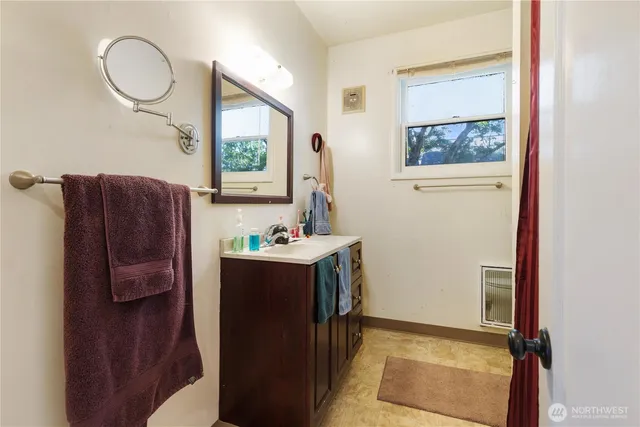 a room with a window and a mirror