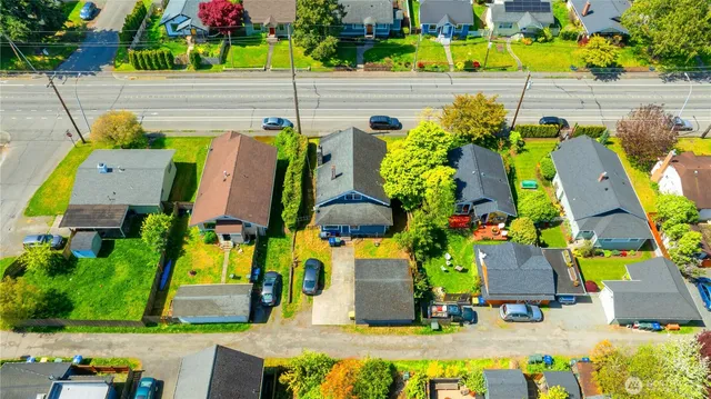 an aerial view of a houses with yard