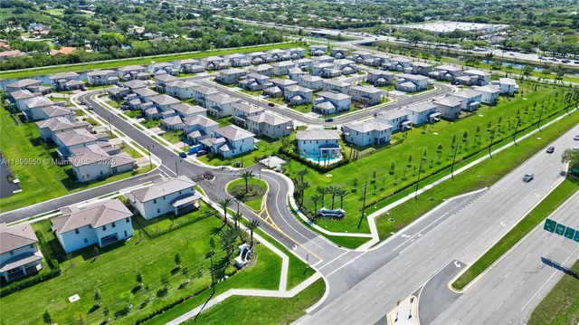 a view of a lake with houses in the back