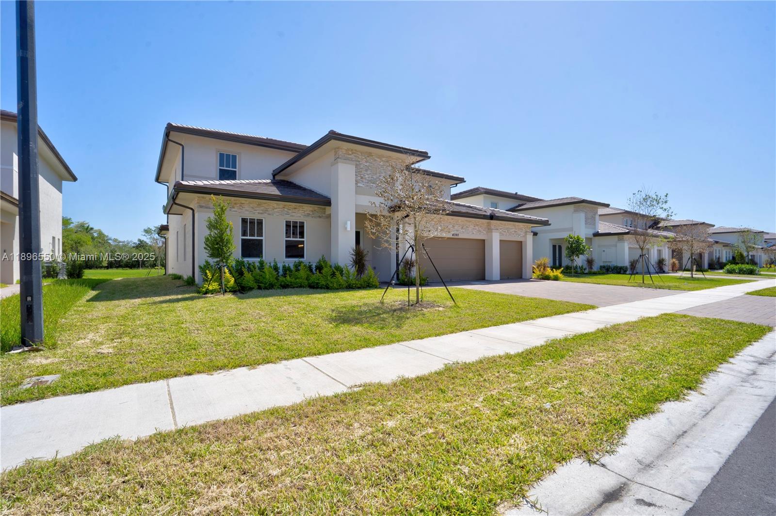 4390 Southwest 122nd Terrace Davie, FL 33330 - Photo 17 of 65 a front view of house with yard and green space
