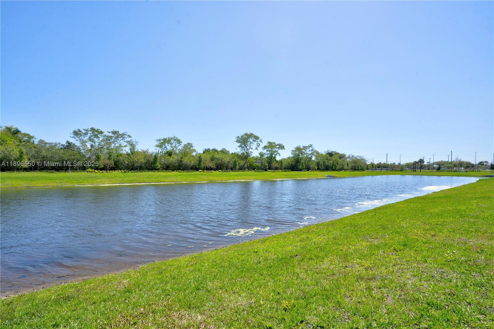 4390 Southwest 122nd Terrace Davie, FL 33330 - Photo 19 of 65 a view of a lake with a big yard