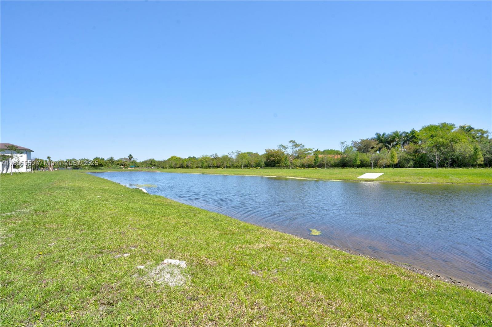 4390 Southwest 122nd Terrace Davie, FL 33330 - Photo 20 of 65 a view of a lake with houses in the back