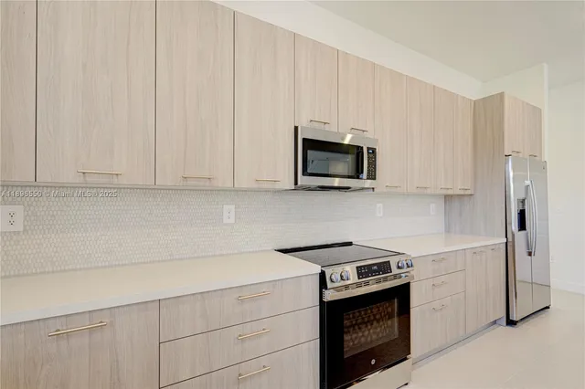 a bathroom with a sink mirror and toilet