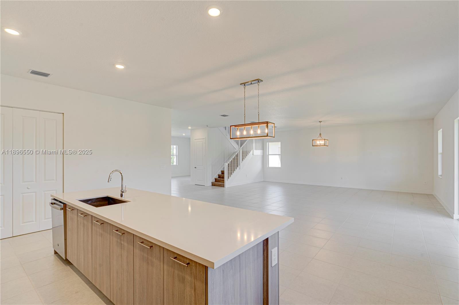 4390 Southwest 122nd Terrace Davie, FL 33330 - Photo 37 of 65 a kitchen with a sink a counter top space and appliances