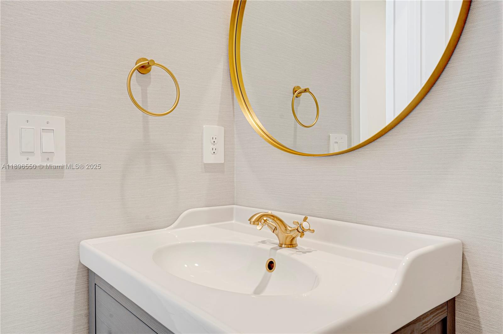 4390 Southwest 122nd Terrace Davie, FL 33330 - Photo 45 of 65 a bathroom with a sink and a mirror