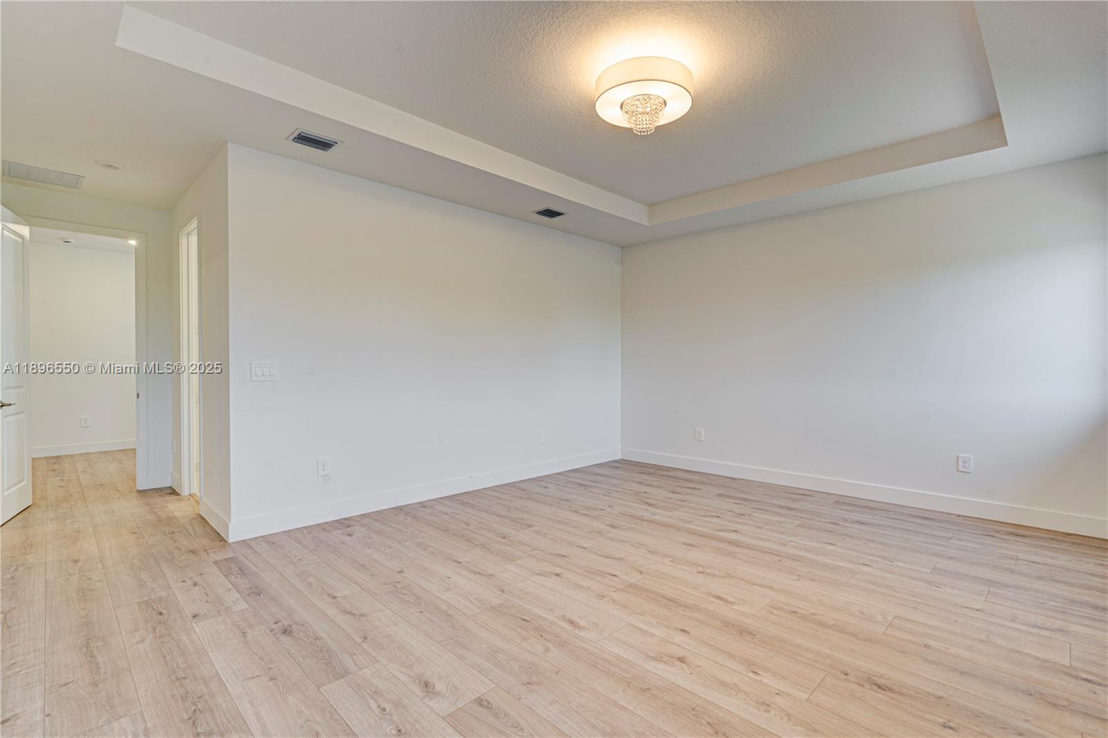 4390 Southwest 122nd Terrace Davie, FL 33330 - Photo 53 of 65 an empty room with wooden floor and windows