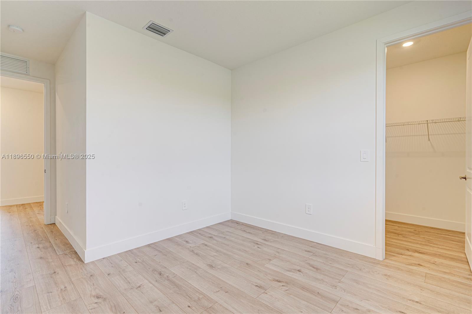 4390 Southwest 122nd Terrace Davie, FL 33330 - Photo 62 of 65 a view of an empty room with wooden floor