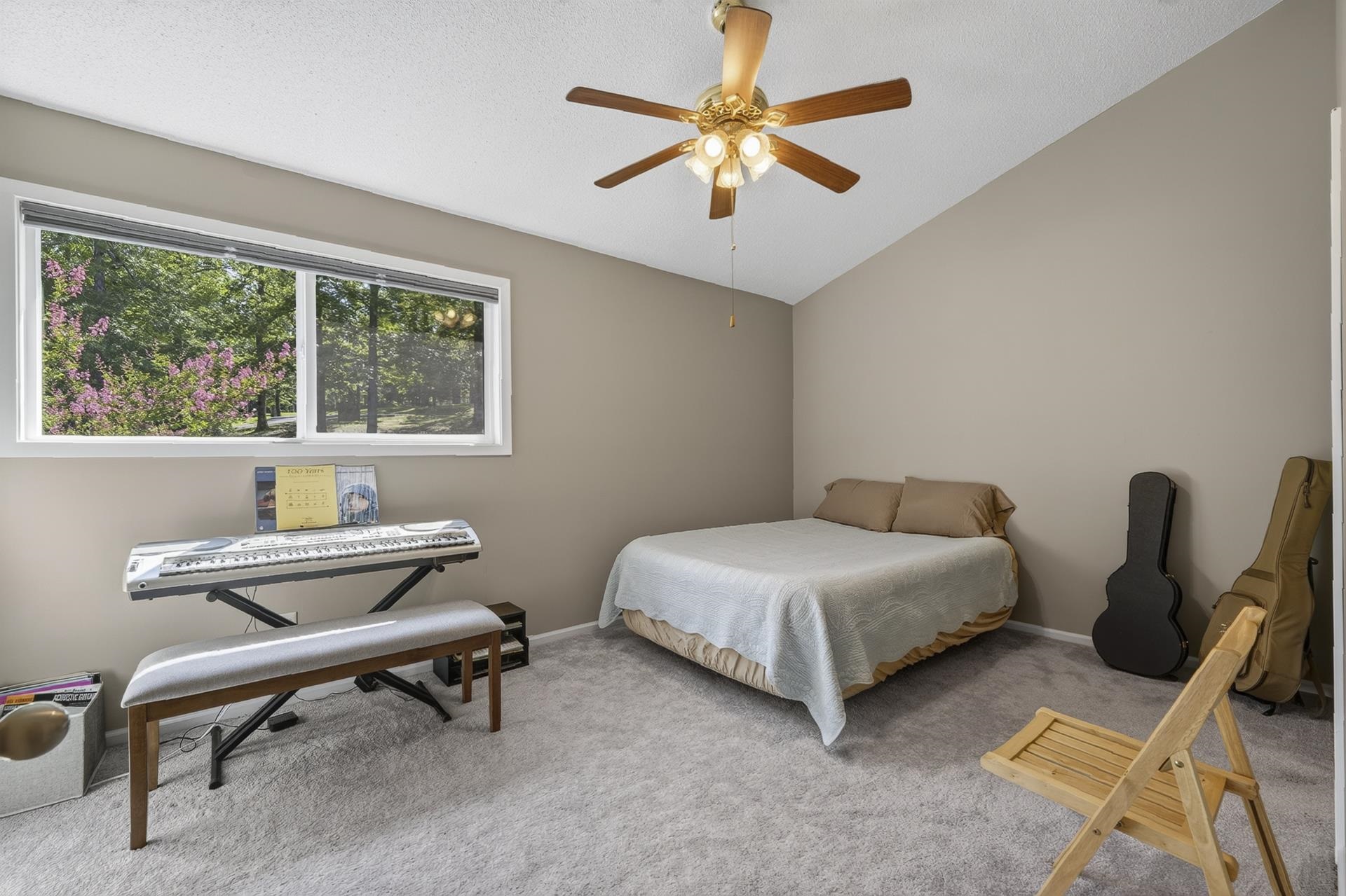 74 Driftwood Road Counce, TN 38326 - Photo 33 of 40 Carpeted room featuring a vaulted ceiling and a ceiling fan with integrated lighting