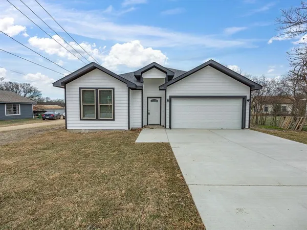 a house with trees in the background